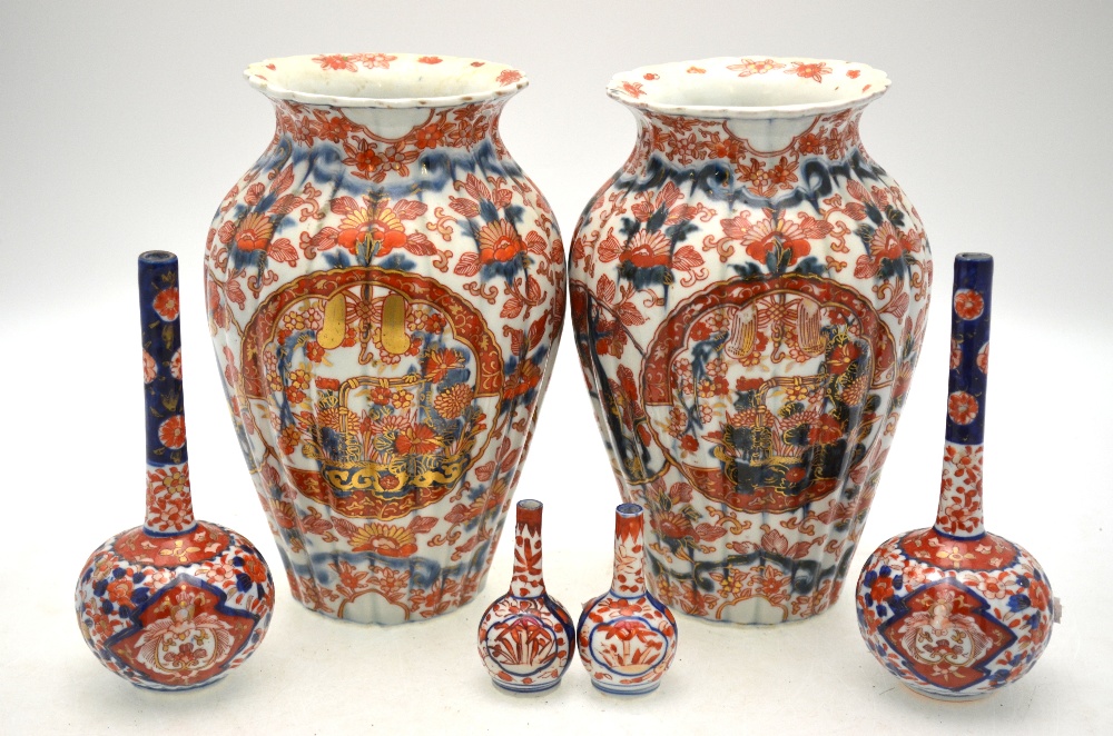 A pair of Japanese Imari vases decorated with floral designs, 25.5 cm h.