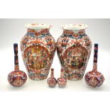 A pair of Japanese Imari vases decorated with floral designs, 25.5 cm h.