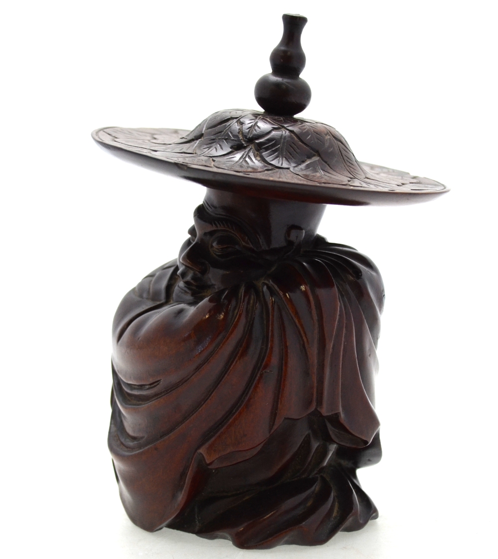 A Chinese hardwood carving of a seated sage wrapped in a cloak and wearing a wide brimmed hat, - Image 2 of 6