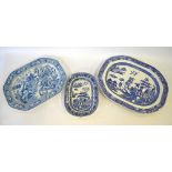 A 19th century blue and white meat plate transfer decorated in a Chinoiserie style with figures in