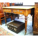 A Victorian oak writing table, the leath