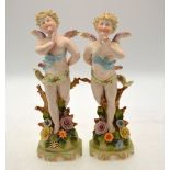 A pair of continental figures of Cupid d