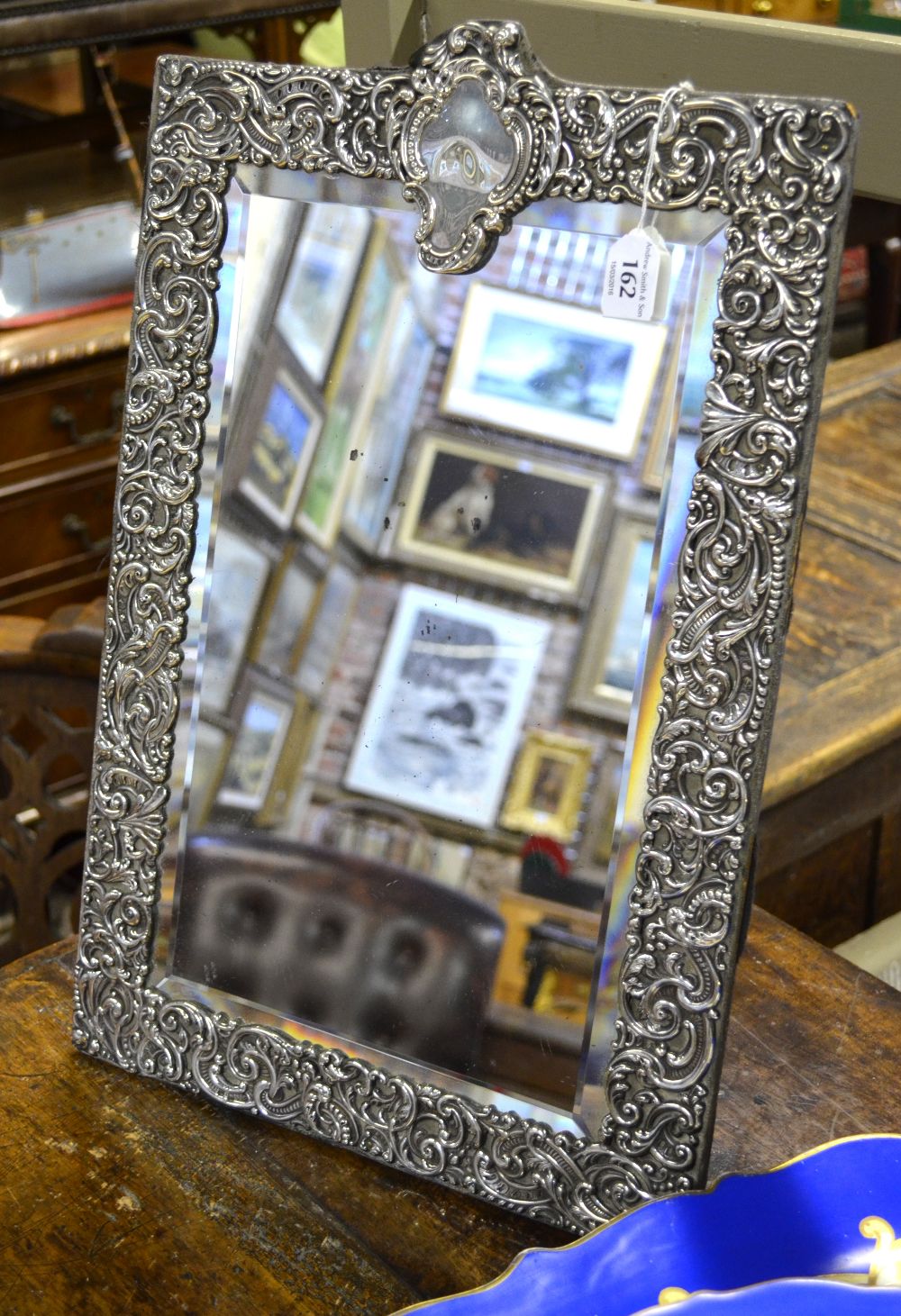 Large Victorian silver-faced easel toilet mirror with bevelled plate surmounted by rococo cartouche,