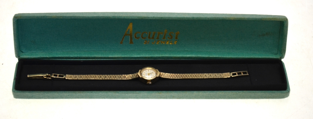 A lady's 9ct gold Accurist wristwatch with 21 jewel movement and textured mesh strap,