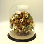 A Victorian basket of flowers and fruit under a glass dome - some dried, some wax and some fabric,