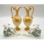 A pair of Victorian Moore wall pockets each moulded in the form of a birds nest with a cherub and