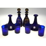 A pair of early 19th century Bristol blue mallet-shaped decanters each with single plain neck ring