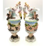 A continental pair of porcelain wine flagons, possibly Sitzendorf,