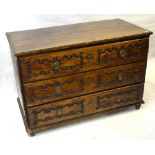 A 17th/18th century Italian provincial oak/walnut commode chest of three long drawers each with