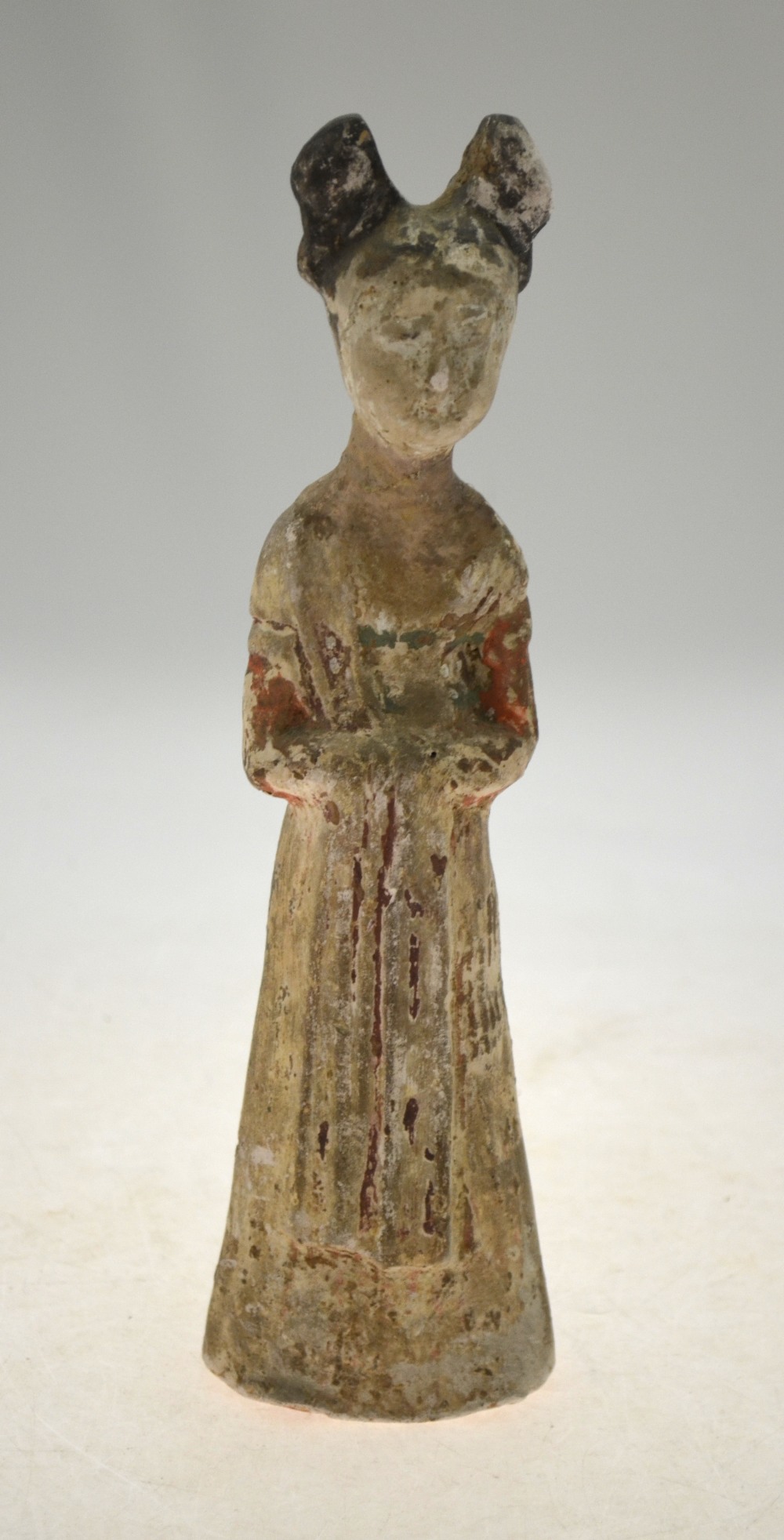 A Chinese Tang standing funerary figure of a court lady, vestiges of cold pigment,