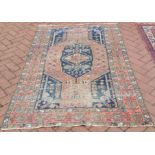 An old Persian Shiraz rug, triple diamond design on blue ground, 1.85 x 1.