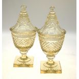 A pair of heavy hobnail cut bonbonieres and covers raised on square star-cut bases, approx. 33 cm h.