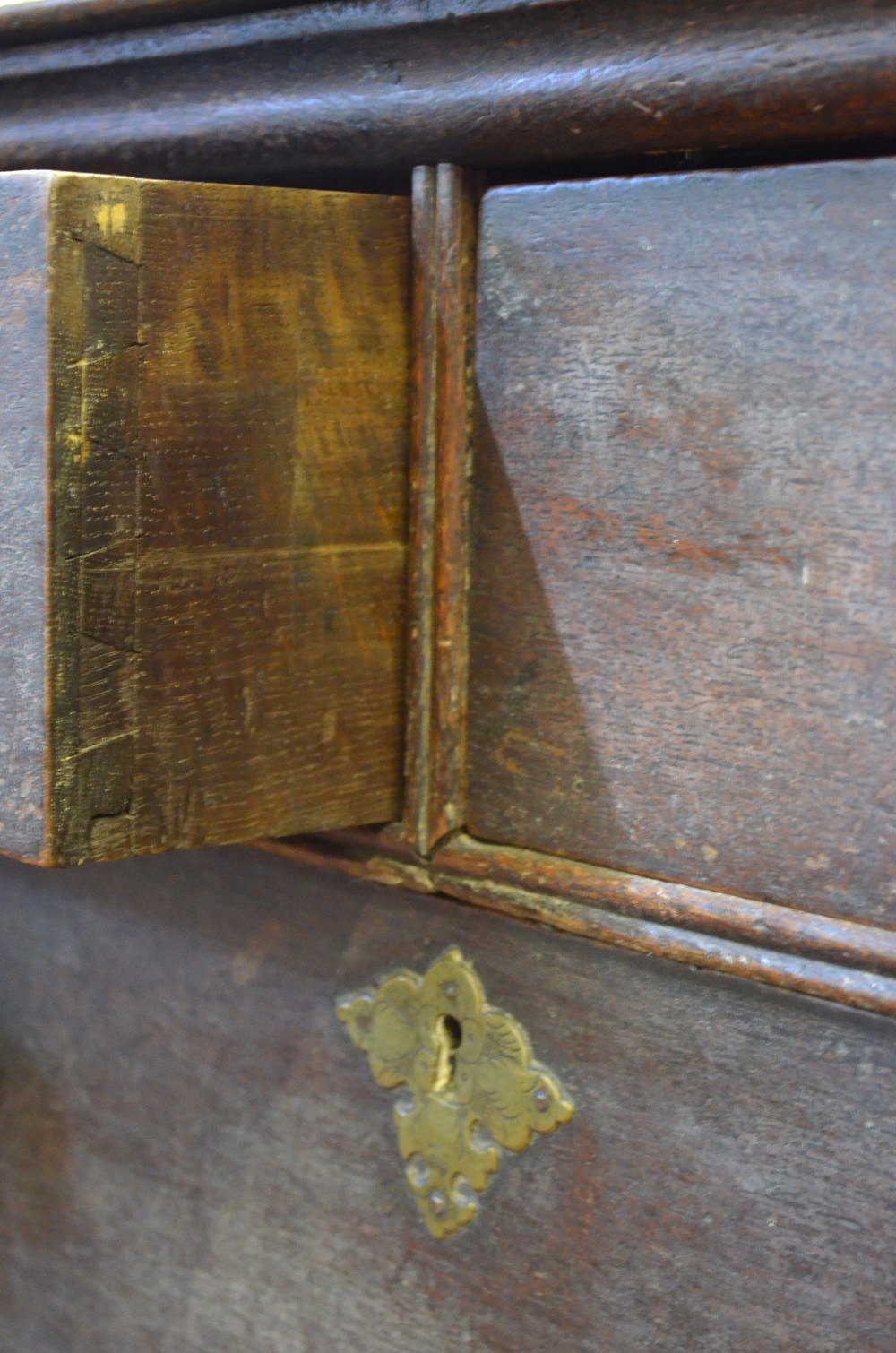 An 18th century oak chest of two short over three long graduated drawers raised on bracket feet, - Image 4 of 5