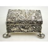 A Continental embossed silver casket with hinged cover,