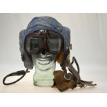 A Korean War Fleet Air Arm pilot officer's blue canvas flying helmet with integral radio headphones