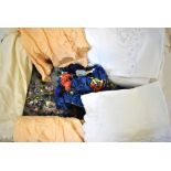 A box containing six peach silk cami-knickers and a cream silk half-slip,