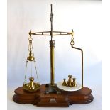 An antique cast iron and brass Agate Balance with brass and marble platforms,