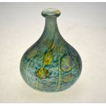An iridescent green glass vase of ovoid tapering form decorated with an organic pattern;