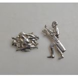 Two brooches, one of male golfer stamped 925,