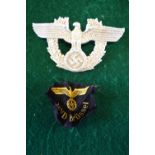 A WWII German Third Reich Police helmet shako plate, a spread wing eagle over a swastika, alloy,