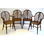 A good set of four 19th century low Windsor armchairs, yew and elm,