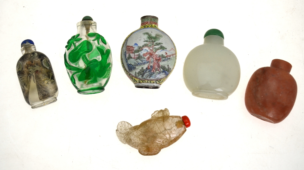 Six Chinese snuff bottles comprising a Canton enamel bottle decorated with a watery landscape, 7.