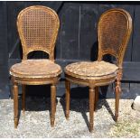 A pair of 19th century French giltwood cane seat and backed side chairs,