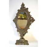 An electroplated toilet mirror with oval plate in cast frame on foliate-decorated pedestal base