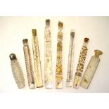 A collection of seven 19th century 'tear catcher' scent bottles with gilt decoration,