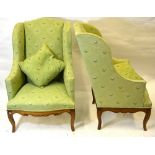 A good pair of 19th century walnut framed serpentine wingback armchairs upholstered in contemporary