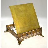 An antique gilt brass book easel