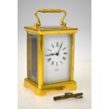 A brass carriage clock with French movement and enamel dial, from Thomas Sly of Salisbury,