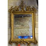 An antique giltwood mirror,