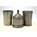 A 19th century pewter tobacco jar and cover with acorn finial, moulded rims and engraved decoration,