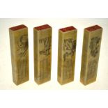 Four Chinese rectangular hardstone seals incised with calligraphy above flowers and foliage,