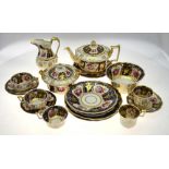 A Ridgway Old English tea service, pattern 2/1043 comprising: Teapot and stand, sucrier and cover,