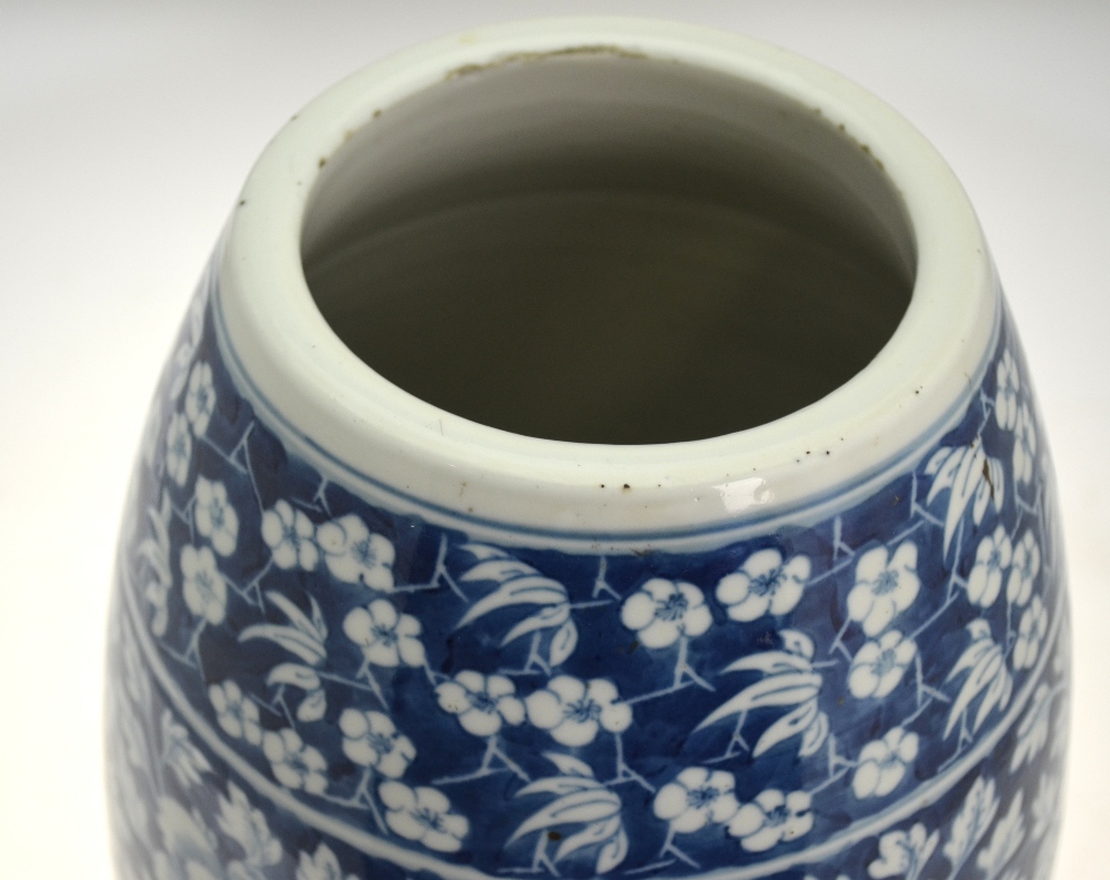 A Chinese blue and white slim barrel shaped vase decorated with peony, flowers, - Image 3 of 5