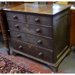 An 18th century oak chest of two short over three long graduated drawers raised on bracket feet,