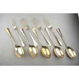 An Edwardian part set of Hanoverian rat-tail flatware, comprising five table spoons and four forks,