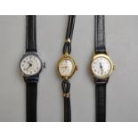 Three lady's watches on black leather straps including two by Oris and one Enicar