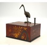 An oriental novelty cigarette box with automaton stork 'picker',