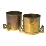 A pair of brass cylindrical measures with twin handles, stamped '3',