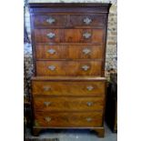 A George III mahogany chest on chest, the Greek-key moulded canopy over a blind fret frieze,