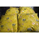 Eight yellow silk floral brocade cushions with piping and fringing,