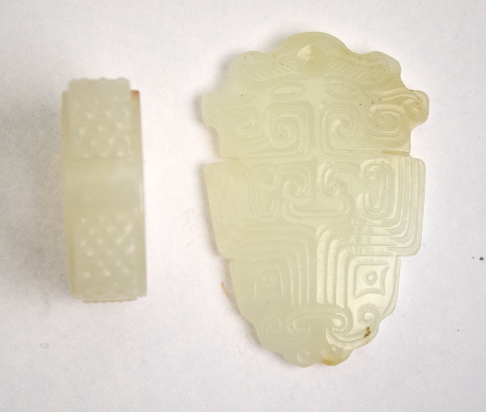A Chinese jade pendant carved with TaoTie masks, 5.5 cm long x 3. - Image 3 of 4