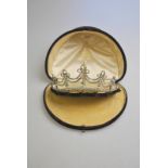 An Edwardian tiara, white paste set,