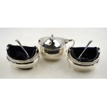 A pair of George III silver oval open salts with loop handles and blue glass liners, John Emes,