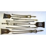 A 19th century steel three piece set of fire irons to/w another steel set with brass handles,