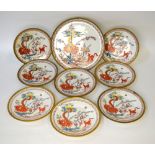 A set of Japanese porcelain plates decorated with a dragon and dog, bamboo, flowers and foliage,