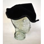 A Philip Somerville, Harrods, asymmetrical black velvet hat, a similar black velvet hat,